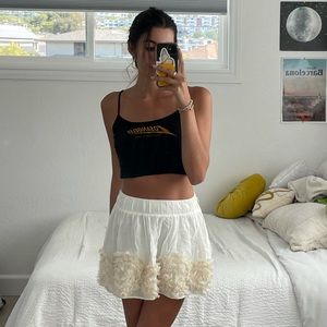 White mini skirt with tan detailing